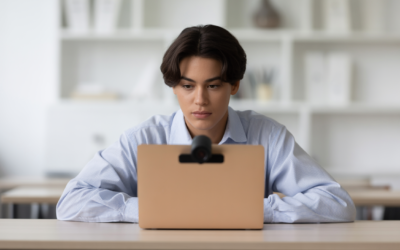 Student taking a secure online proctored exam with a webcam.